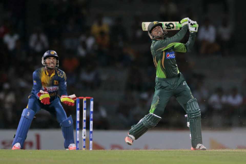 Shoaib Malik watches the ball sail into the stands