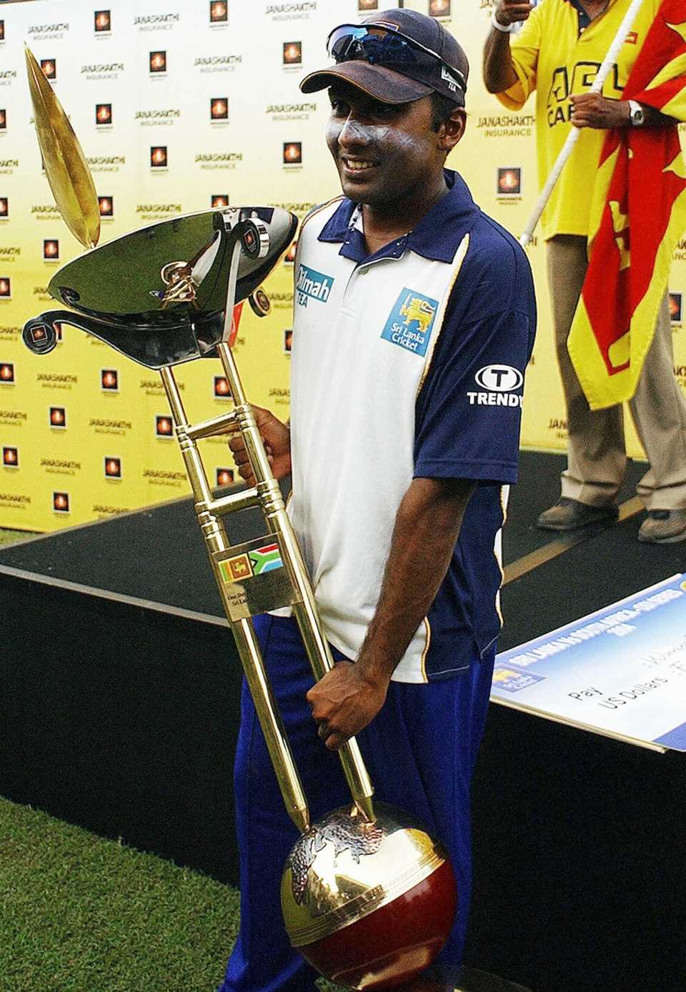 Mahela Jayawardene poses with the winner's trophy