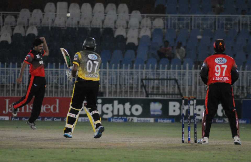 Mohammad Waheed takes a return catch to dismiss Zafar Ali