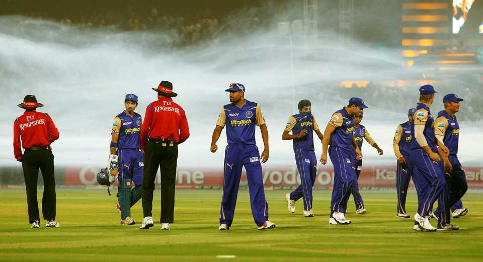 Players leave the field as the start of play is held up due low-hanging smoke from earlier mosquito fumigation, Rajasthan Royals v Mumbai Indians, IPL, Jaipur, April 11, 2010