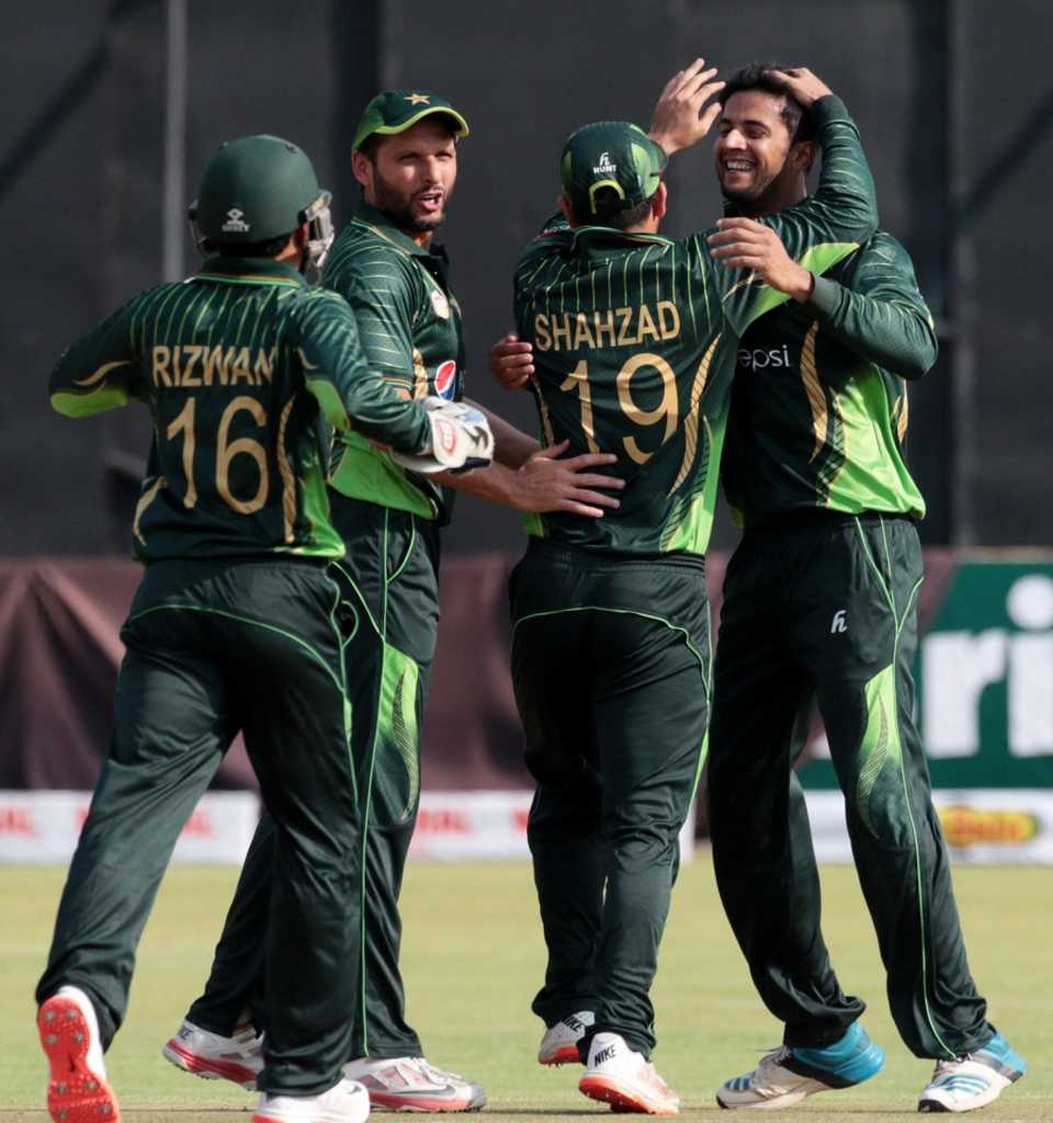 Imad Wasim is mobbed by his team-mates, Zimbabwe v Pakistan, 1st T20, Harare, September 27, 2015