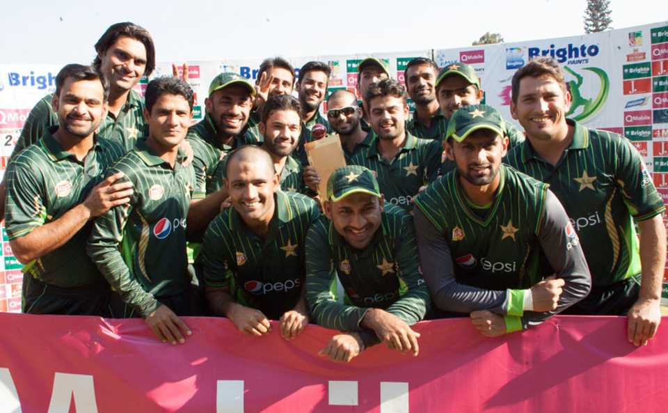 The Pakistan players with the trophy