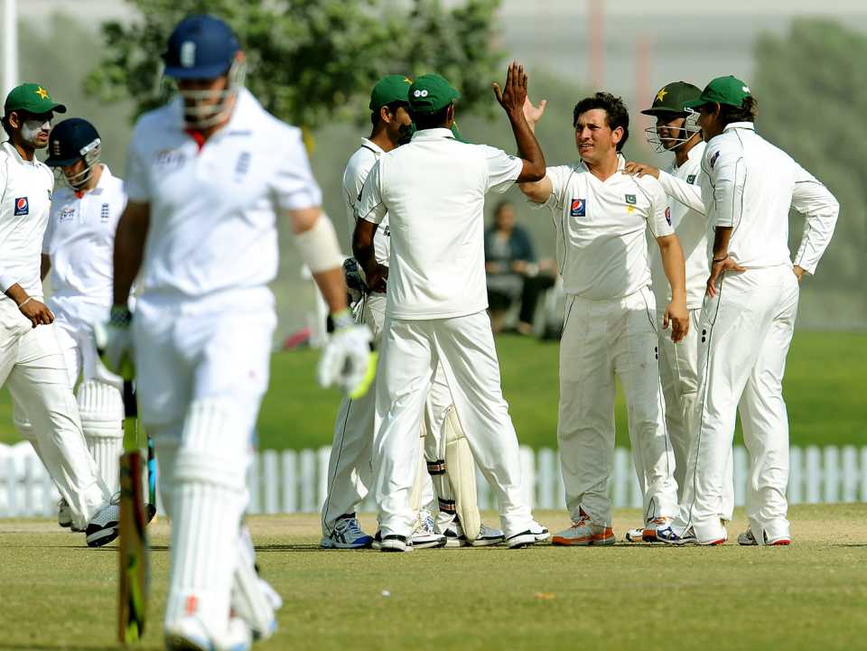 Pakistan celebrate Yasir Shah's dismissal of Andrew Strauss, PCB XI v England XI, tour match, 3rd day, Dubai, January 13, 2012