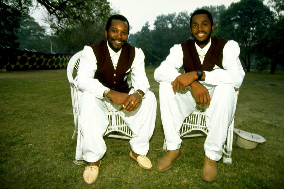 Malcolm Marshall and Courtney Walsh pose for photographers dressed in traditional Pakistani dress 