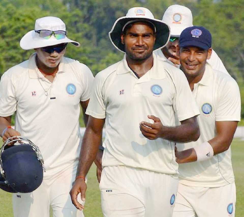 Rahul Shukla is congratulated by team-mates after finishing with a six-for