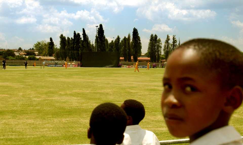 Soweto school children watch the warm up match between New Zealand and Gauteng at Soweto Cricket Oval in Soweto