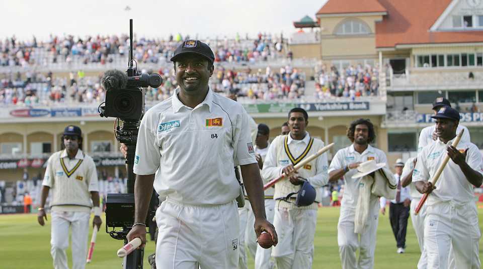 Muttiah Muralitharan leads the Sri Lanka side off the field