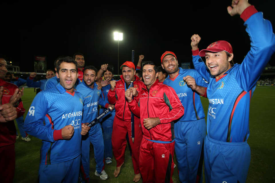 The Afghanistan players soak in the celebrations after securing the series