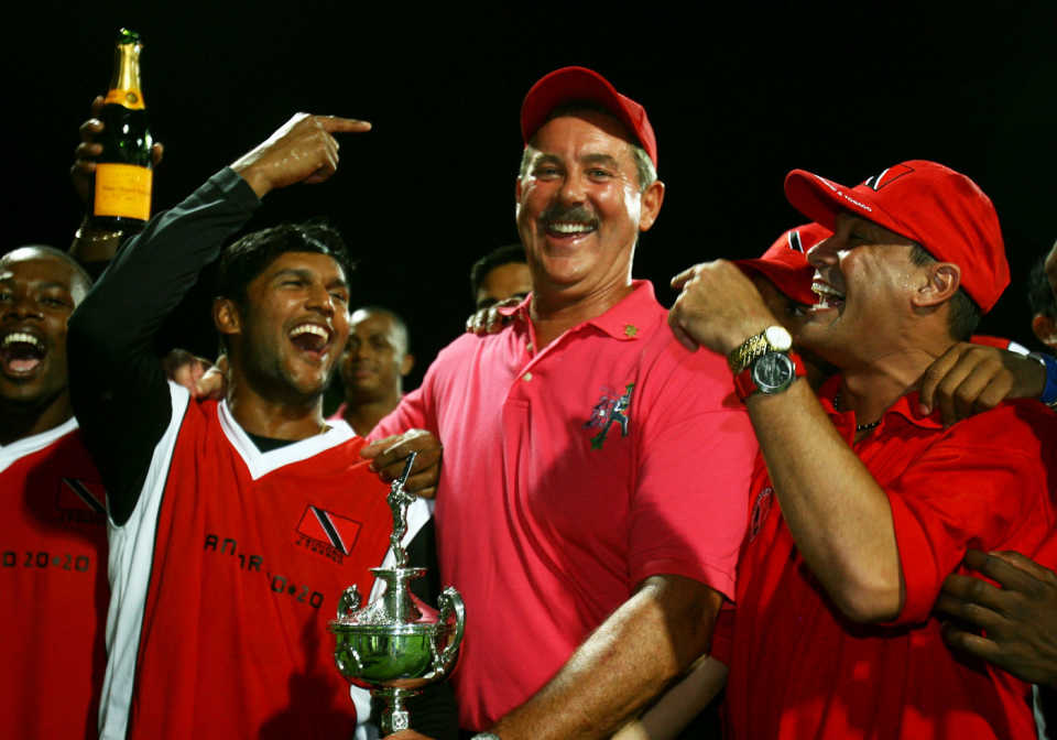 Tr&T captain Daren Ganga celebrates the victory with Allen Stanford