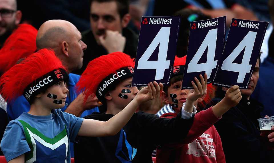 Young fans in red headgear cheer for Leicestershire