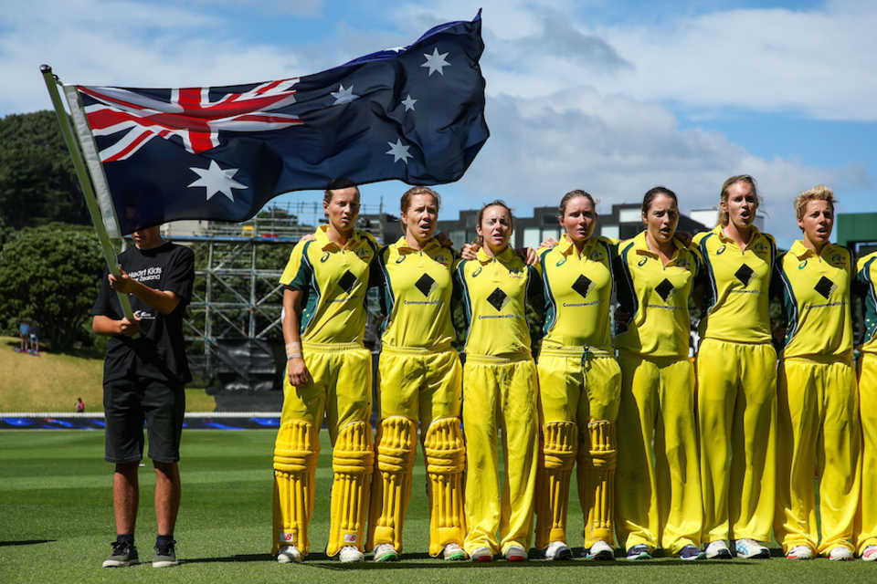 The Australia Women players sing the national anthem
