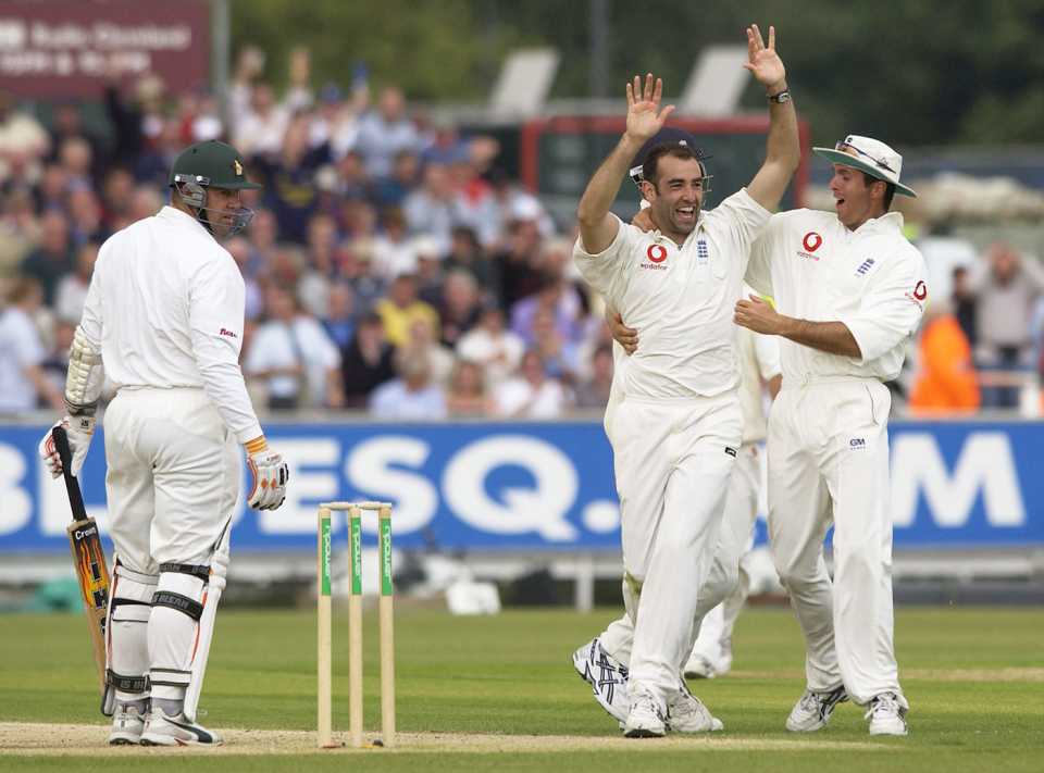 Richard Johnson celebrates taking the wicket of Heath Streak
