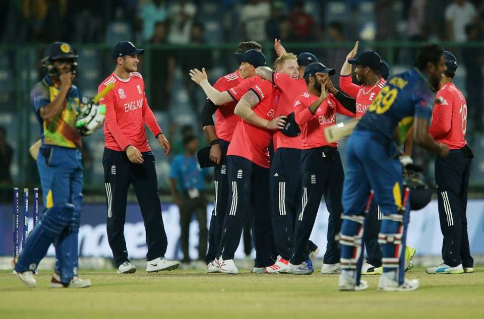 England players celebrate their win while Sri Lanka's players come to terms with their defeat
