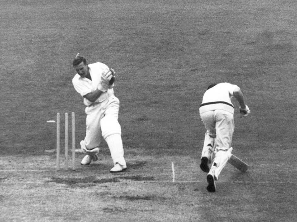 Bill Lawry is run out as Jim Parks breaks the stumps