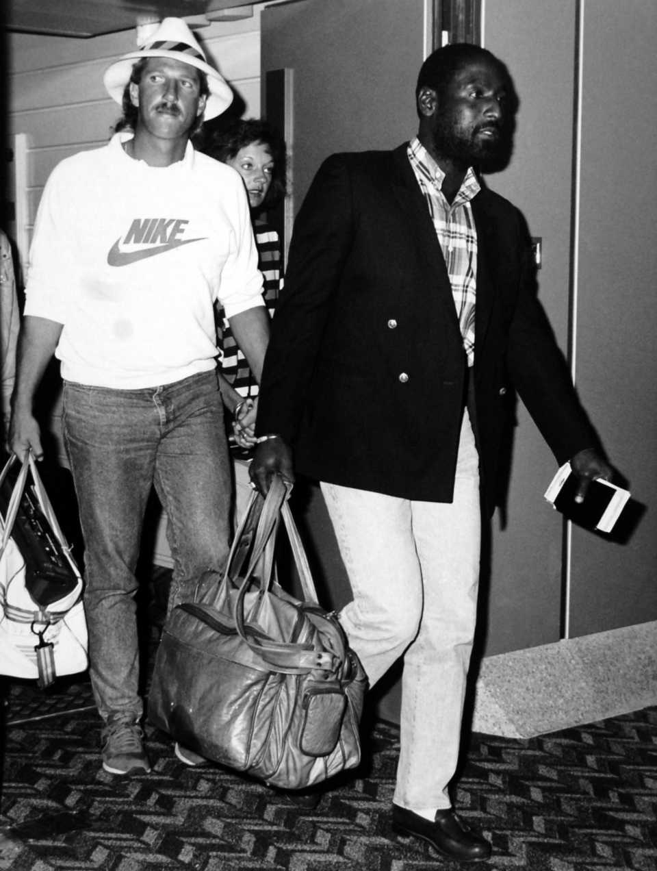 Ian Botham and Viv Richards arrive in London after England's tour of West Indies