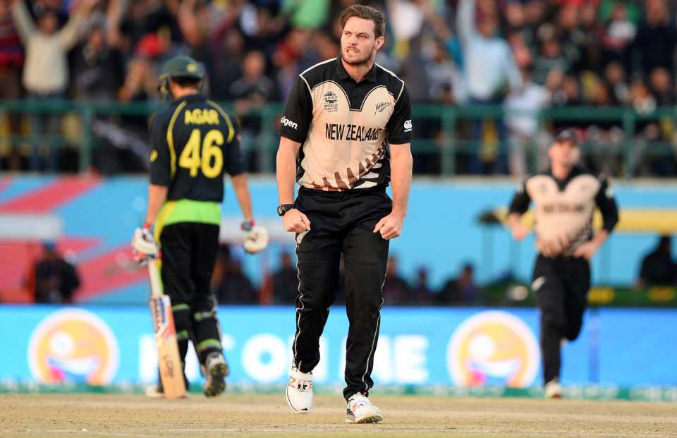 Mitchell McClenaghan celebrates the wicket of Mitchell Marsh