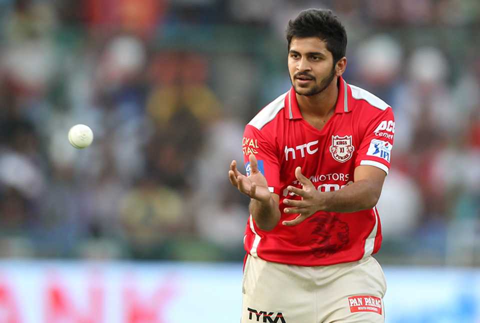 Shardul Thakur collects the ball
