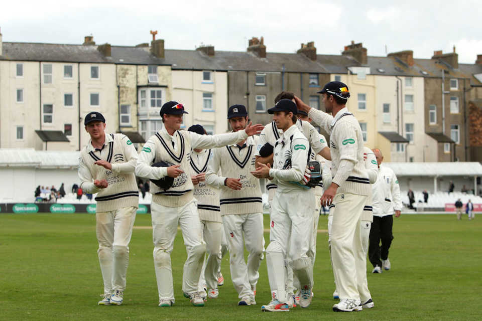 Middlesex's players celebrate a great victory