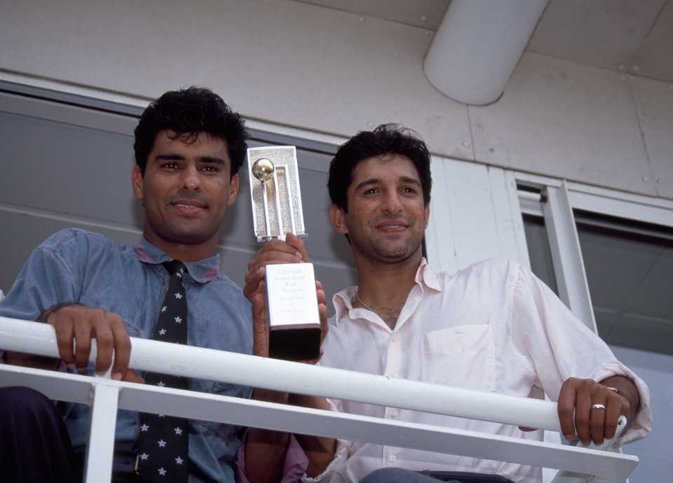 Waqar Younis (left) and Wasim Akram hold up the trophy
