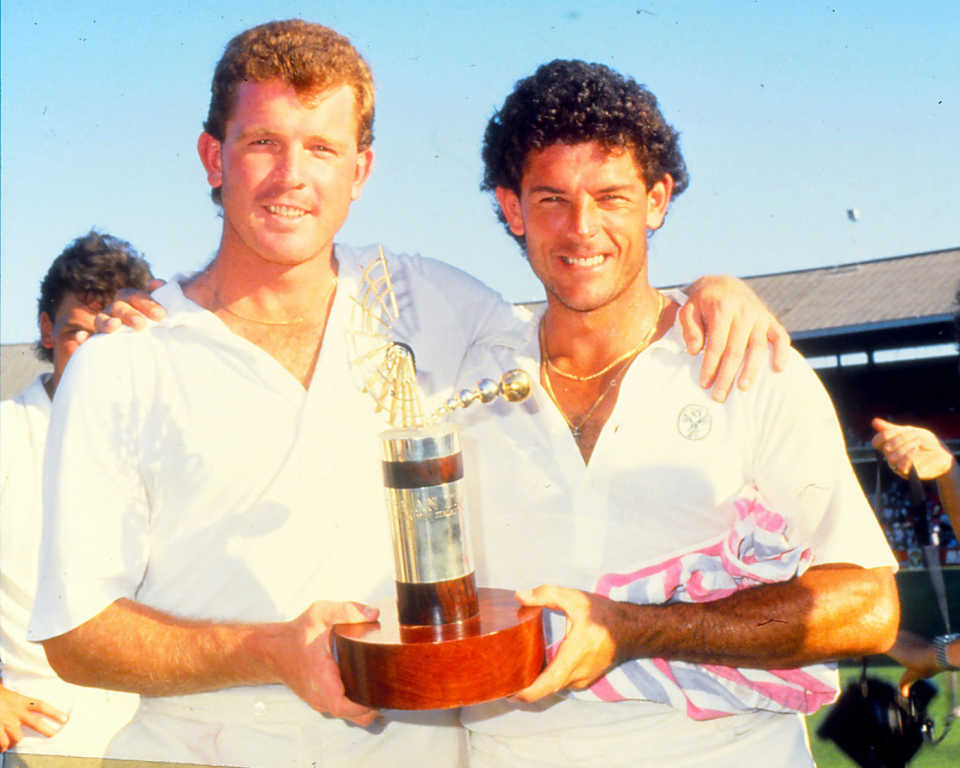 Craig McDermott and Mike Whitney hold the Trans-Tasman Trophy, Australia v New Zealand, 3rd Test, Melbourne, 5th day, December 30, 1987