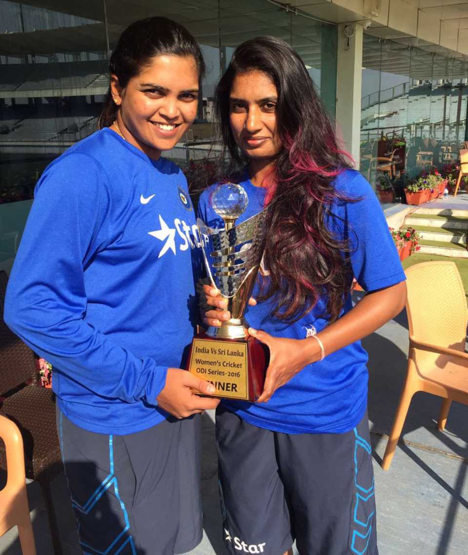 Veda Krishnamurthy and Mithali Raj pose with the trophy