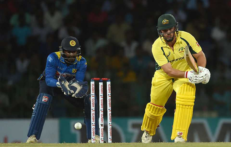 Aaron Finch taps the ball towards the off side