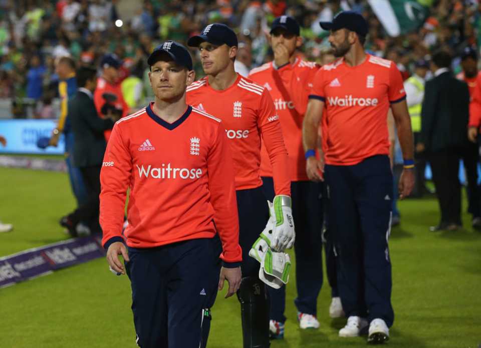 Eoin Morgan leads his beaten team from the field