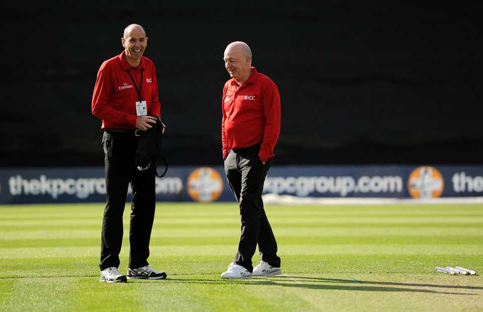 Umpires Roland Black and Alan Neill inspect the wicket