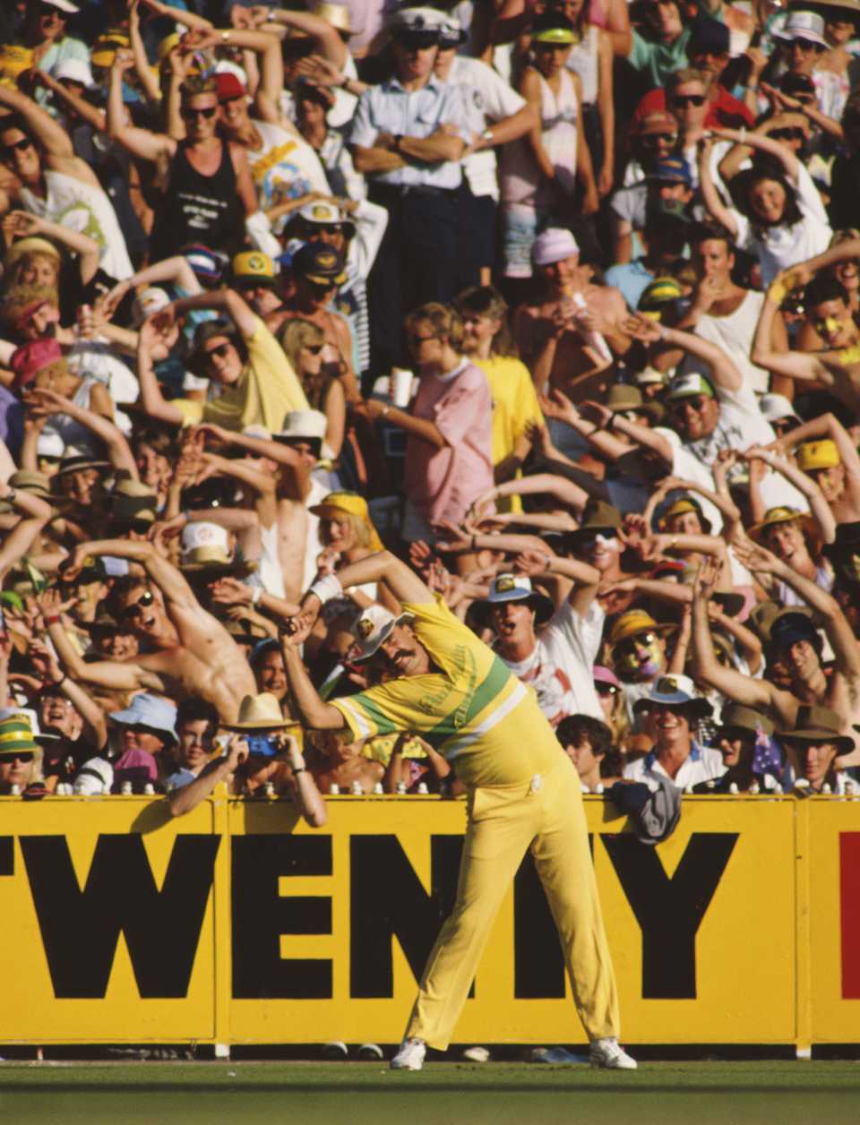 Merv Hughes stretches and the crowd follows, Australia v West Indies, 1st final, Benson & Hedges World Series, Melbourne, January 14, 1989