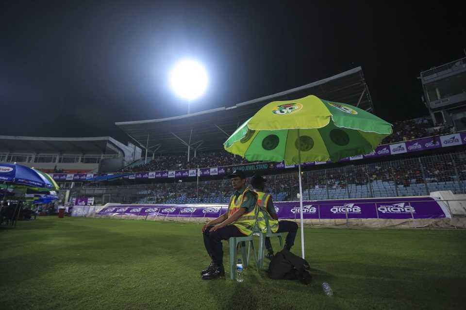 Bangladeshi police officials guard the field at Sher-e-Bangla Stadium