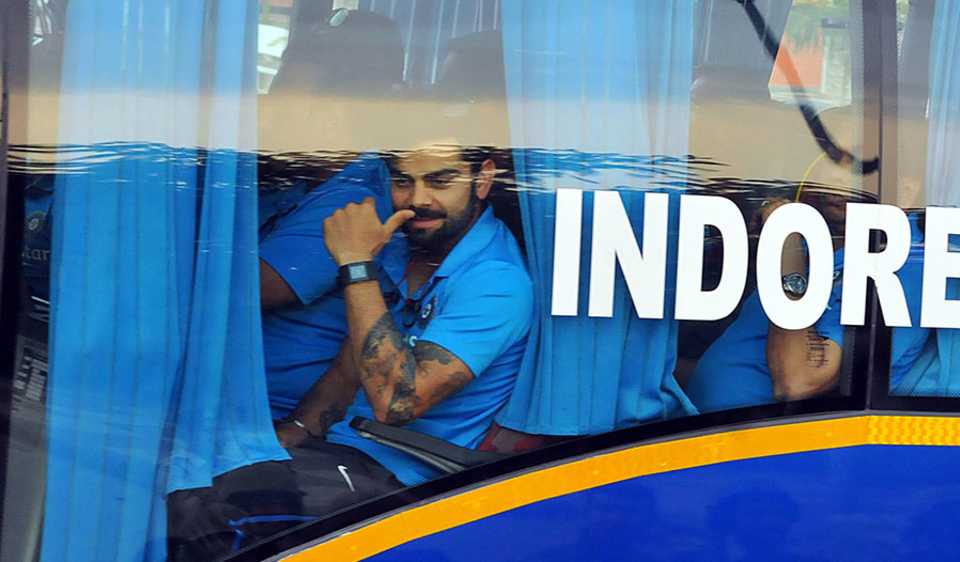 Virat Kohli peers out of the team bus, India v South Africa, 2nd ODI, Indore, October 14, 2015
