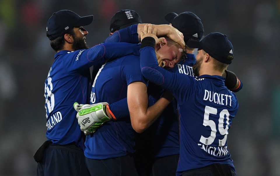 Jake Ball is engulfed by his team-mates, Bangladesh v England, 1st ODI, Dhaka, October 7, 2016