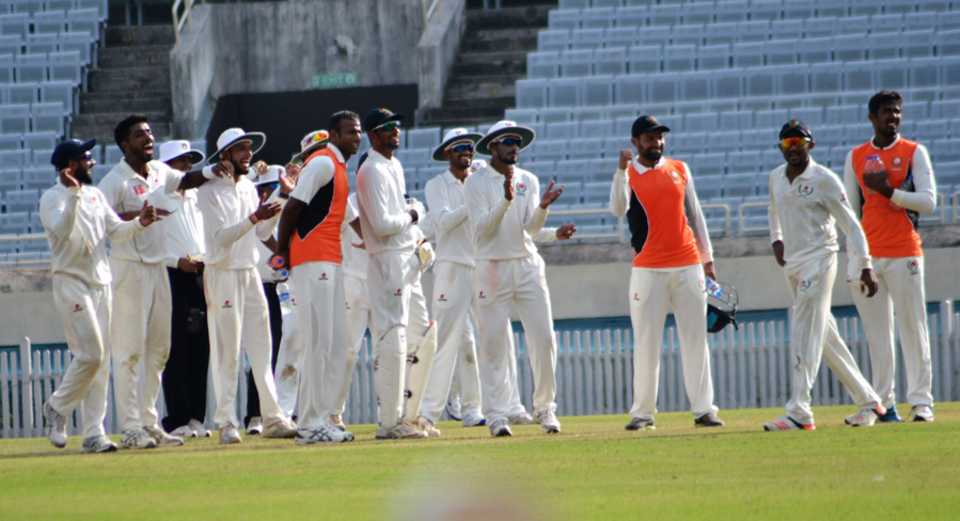 Chhattisgarh players get together after a wicket