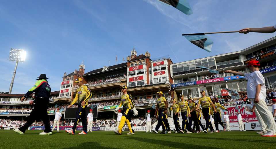 The Hampshire players walk out to the ground