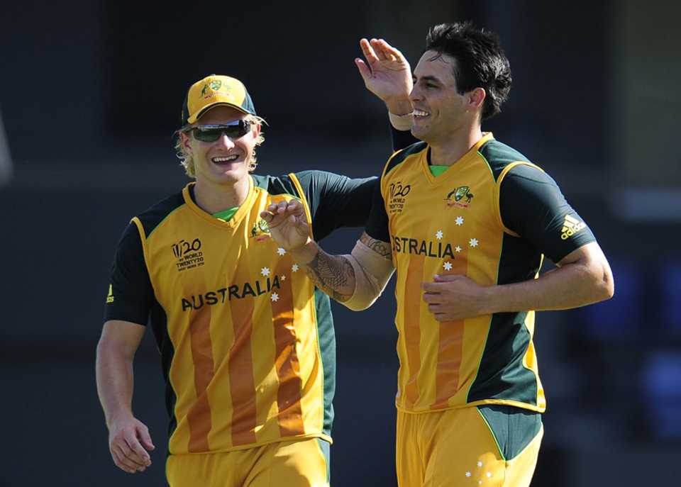 Mitchell Johnson and Shane Watson celebrate a wicket