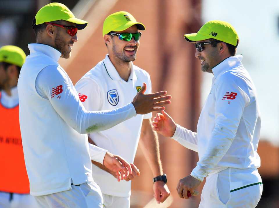 Faf du Plessis, Stephen Cook and Dean Elgar celebrate a wicket