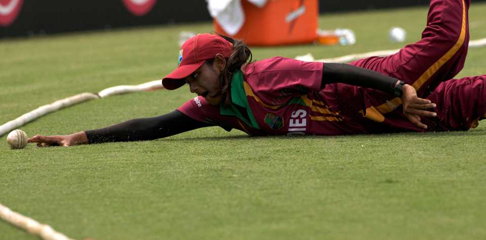 Anisa Mohammed dives in an attempt to save a boundary