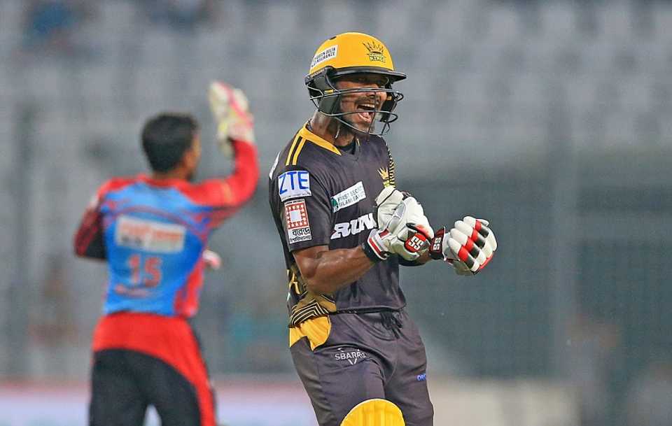 Sabbir Rahman punches the air with joy after reaching 100
