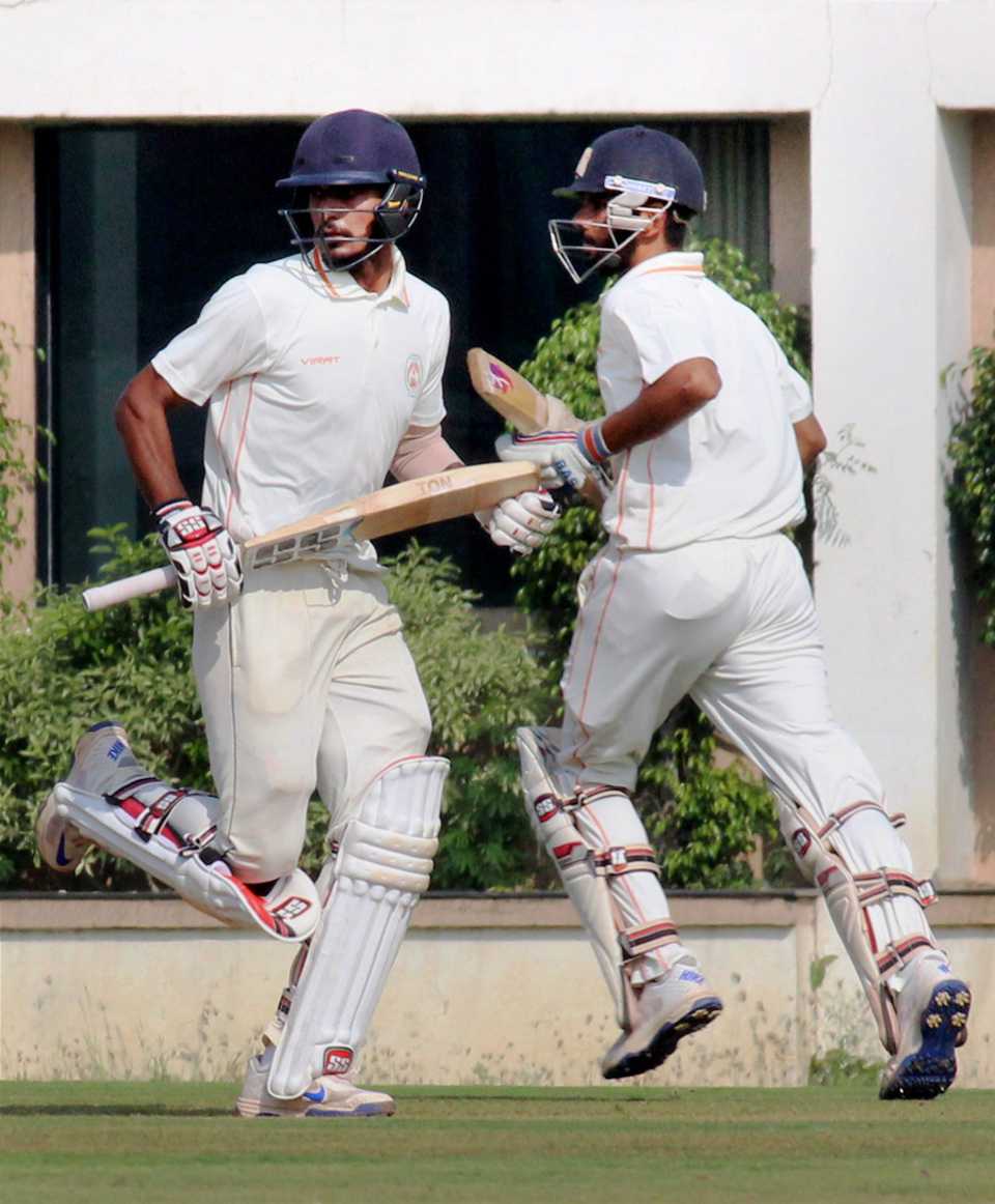 Deepak Hooda runs between the wickets with Atit Sheth during his 98