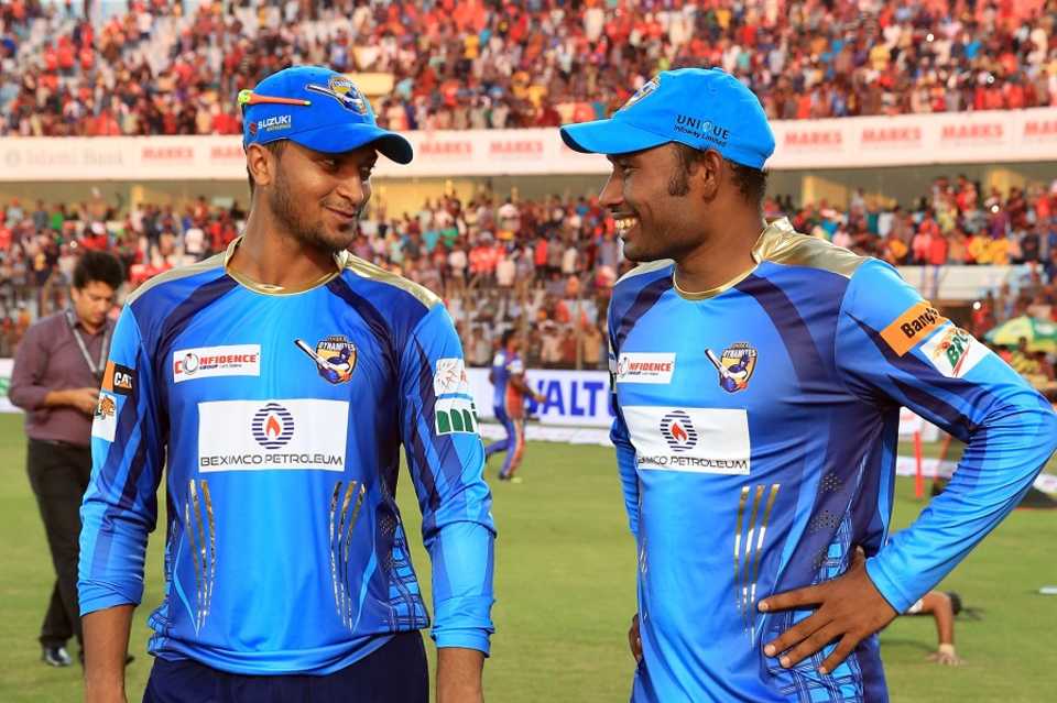 Man of the Match Mohammad Shahid and Shakib Al Hasan share a moment after their win