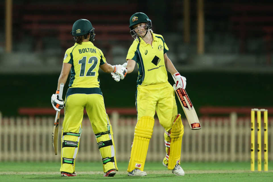 Meg Lanning and Nicole Bolton shake hands after the latter's half-century