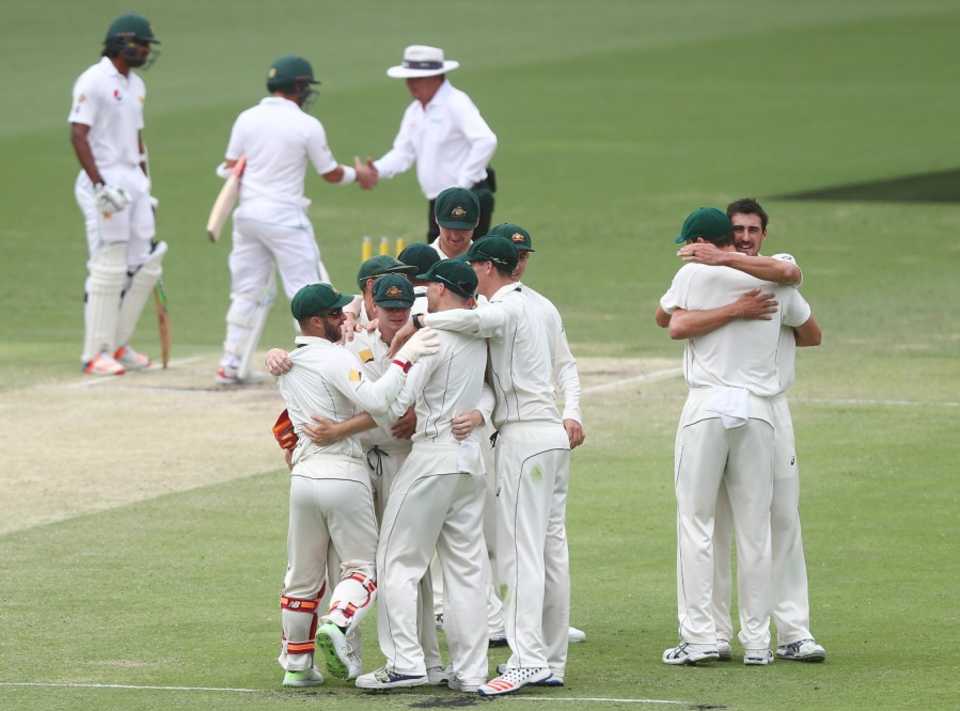 The Australian players embrace after completing a 39-run win, Australia v Pakistan, 1st Test, Brisbane, 5th day, December 19, 2016
