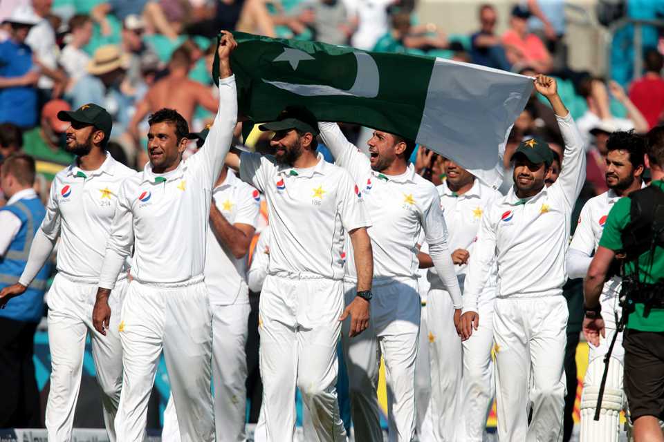 Misbah-ul-Haq leads his players in a lap of honour