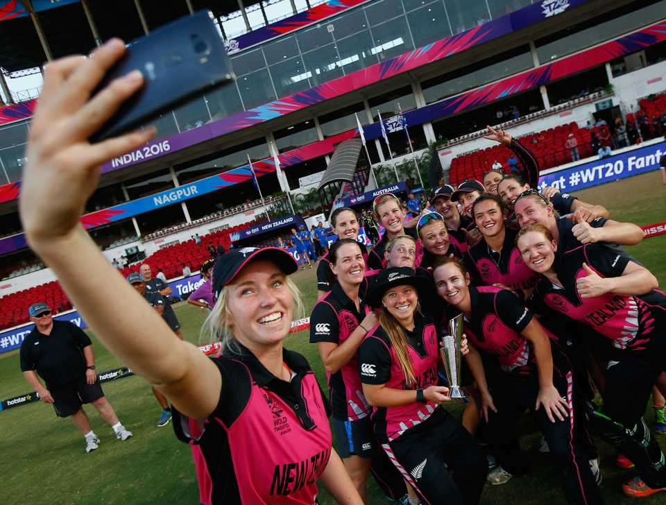 Leigh Kasperek (holding the trophy) poses for a selfie with her team-mates