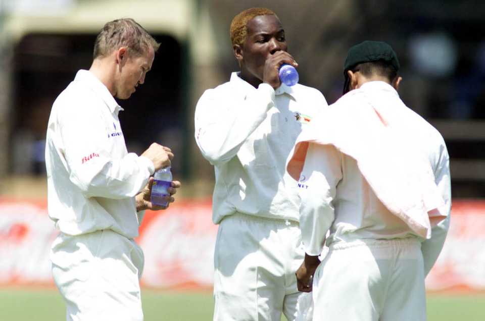Andy Flower and Hamilton Masakadza take a drinks break, Zimbabwe v South Africa, 1st Test, Harare, 4th day, September 10, 2001