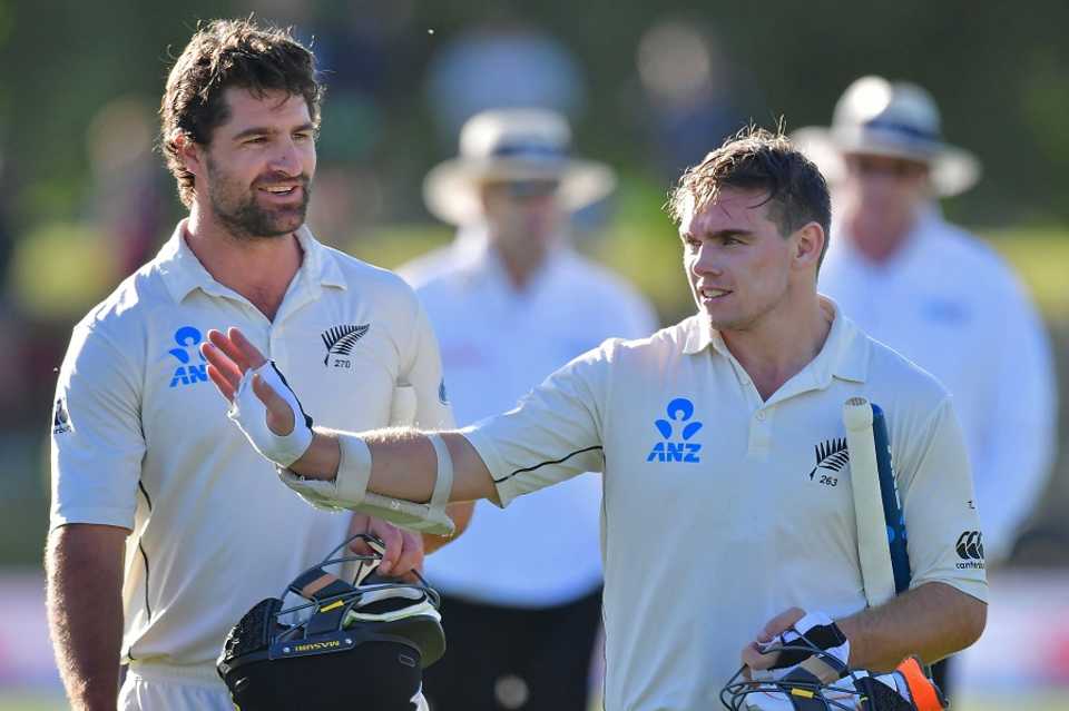 Colin de Grandhomme and Tom Latham walk back after securing a nine-wicket win