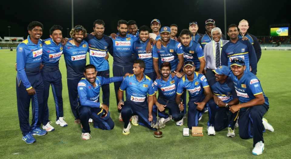 The Sri Lanka players celebrate their five-wicket win