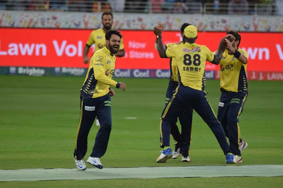 Mohammad Hafeez celebrates with team-mates after picking up a wicket, Lahore Qalandars v Peshawar Zalmi, PSL 2016-17, Dubai, February 24, 2017