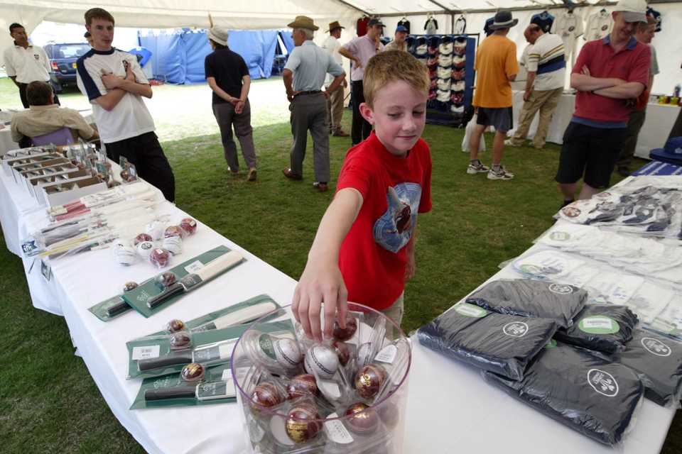 A boy picks a ball out of a bowl at the merchandise stall, Surrey v Warwickshire, day two, County Championship, Guildford, Surrey, July 22, 2004