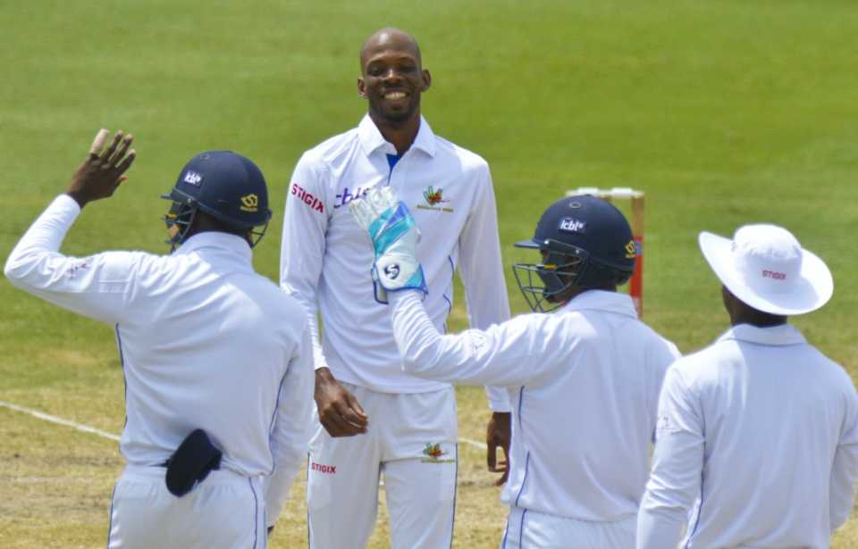 Roston Chase celebrates one of his seven wickets